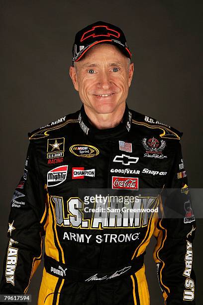 Mark Martin, driver of the U.S. Army Chevrolet, poses for a photo during the NASCAR Sprint Cup Series media day at Daytona International Speedway on...