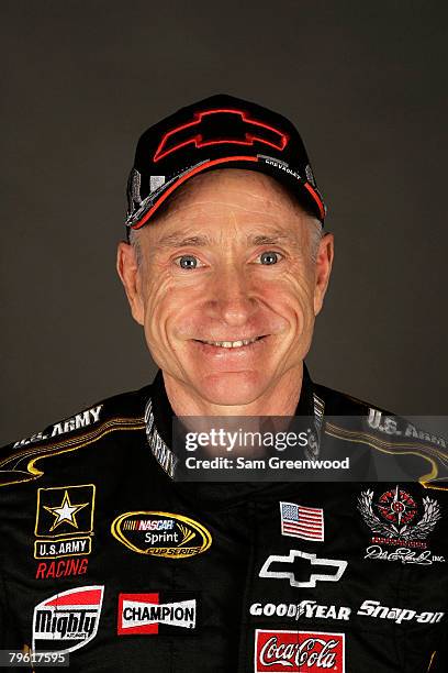 Mark Martin, driver of the U.S. Army Chevrolet, poses for a photo during the NASCAR Sprint Cup Series media day at Daytona International Speedway on...