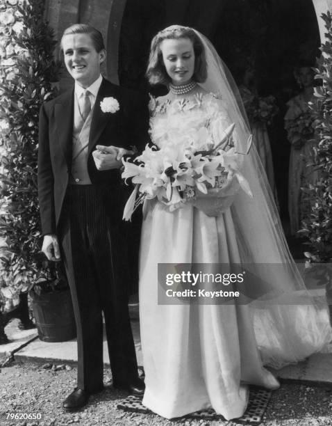 John Julius Cooper, son of Alfred Duff Cooper, 1st Viscount Norwich, marries Miss Anne Clifford at St Edward's Church in Sutton Park, Surrey, 5th...