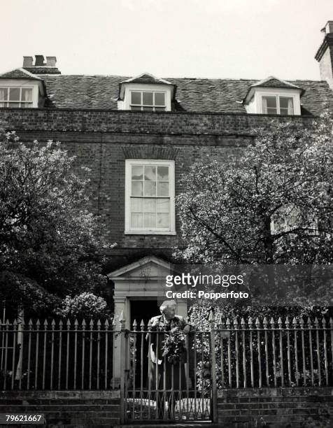 English writer and novelist Agatha Christie stands at the front gate of her home, Winterbrook House near Wallingford, Oxfordshire in 1950. Agatha...
