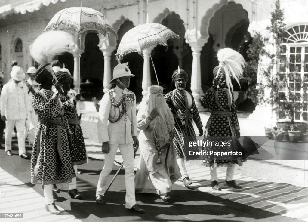 British Royalty. pic: 1922. HRH.Edward, Prince of Wales, left, pictured with the Begum of Bhopal walking to the Durbar Hall at the Sadar Manzil Palace while on his tour of India. The Prince of Wales (1894-1972) was to become King Edward VIII for a short w