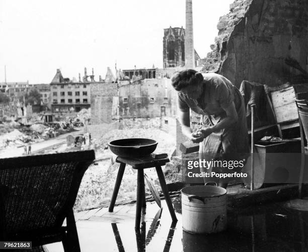 War and Conflict, Post World War Two, Germany, pic: circa 1946, A German woman carries on with her work amid the ruins of Essen in the Ruhr