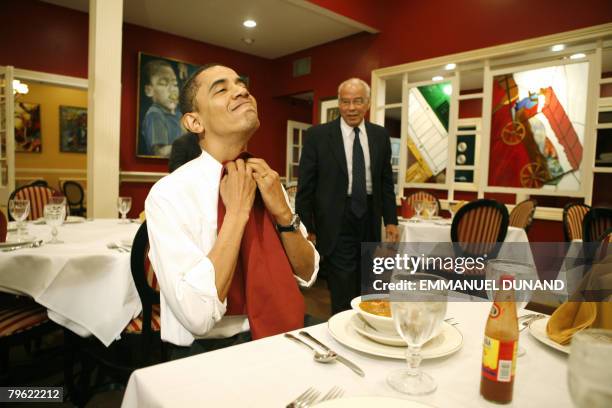 Democratic presidential candidate Illinois Senator Barack Obama puts on a napkin while eating a gumbo with Chairman of Louisiana Recovery Authority...