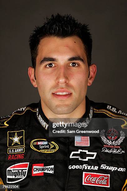 Aric Almirola, driver of the U.S. Army Chevrolet, poses for a photo during the NASCAR Sprint Cup Series media day at Daytona International Speedway...