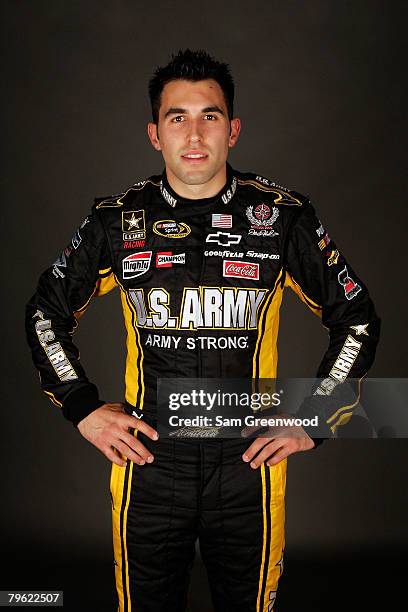 Aric Almirola, driver of the U.S. Army Chevrolet, poses for a photo during the NASCAR Sprint Cup Series media day at Daytona International Speedway...