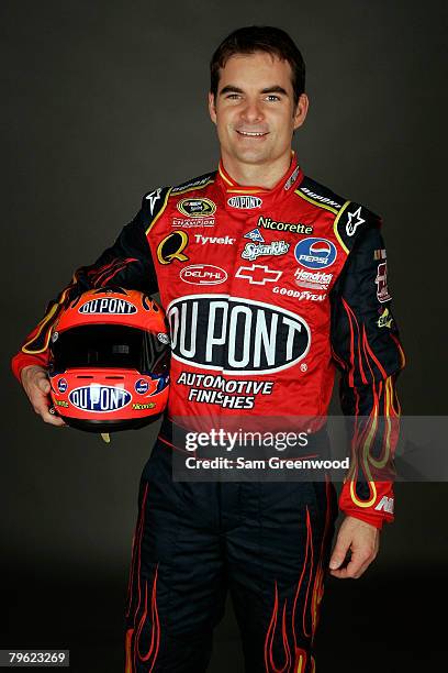 Jeff Gordon, driver of the DuPont Chevrolet, poses for a photo during the NASCAR Sprint Cup Series media day at Daytona International Speedway on...