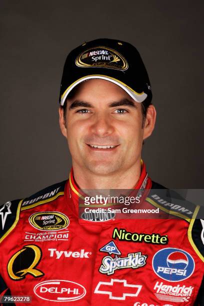 Jeff Gordon, driver of the DuPont Chevrolet, poses for a photo during the NASCAR Sprint Cup Series media day at Daytona International Speedway on...