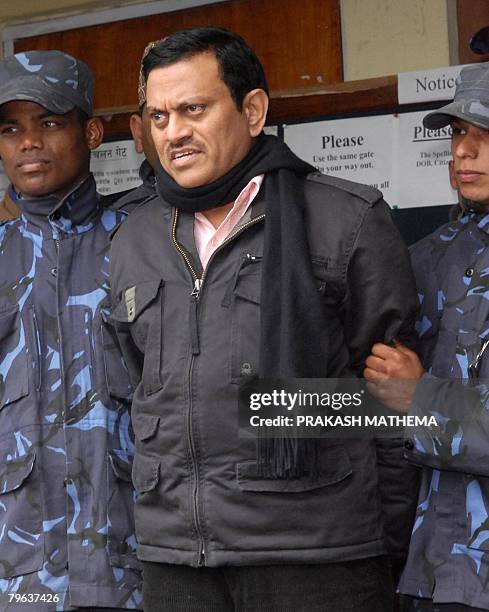 Indian doctor Amit Kumar , believed to have masterminded an illegal kidney transplant operation in India, is escorted by police officials in...