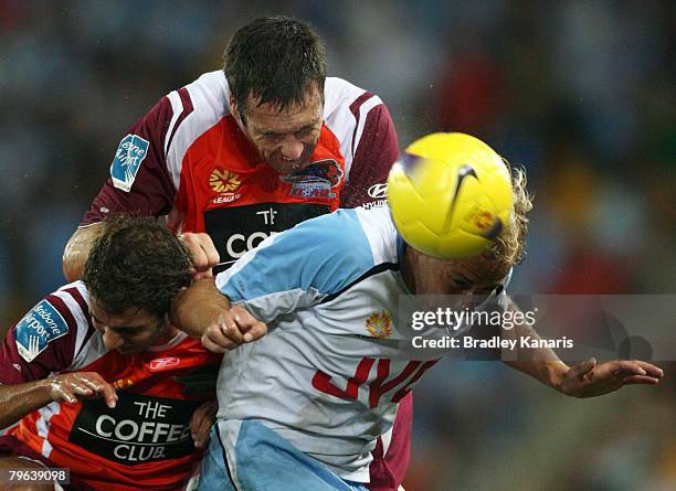 Ruben Zadkovich of Sydney, Josh McCloughan and Michael Zullo of the Roar compete for the ball during the A-League minor semi final second leg match...