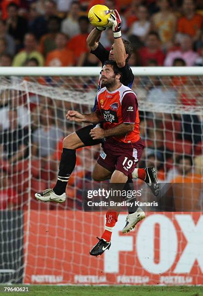 Sasa Ognenovski of the Roar pressures goalkeeper Clint Bolton of Sydney during the A-League minor semi final second leg match between the Queensland...