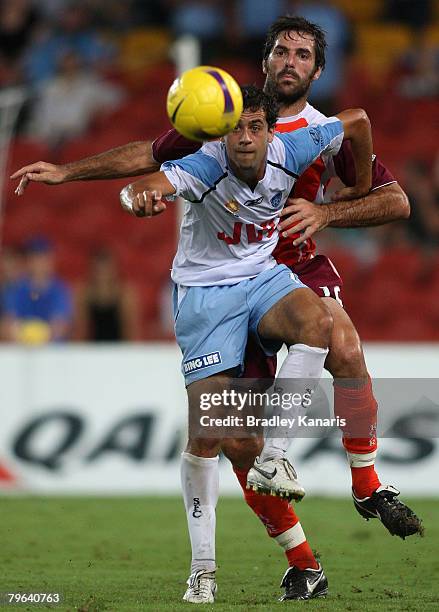 Alex Brosque of Sydney and Sasa Ognenovski of the Roar compete for the ball during the A-League minor semi final second leg match between the...