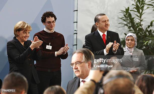 German Chancellor Angela Merkel and Turkish Prime minister Recep Tayyip Erdogan discuss with Turkish and German pupils and students at the...