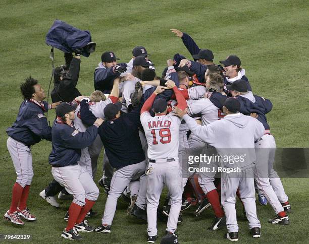 Boston Red Sox celebrate after defeating the New York Yankees in Game Seven, 10-3, of the American League Championship Series, Wednesday, October 20,...