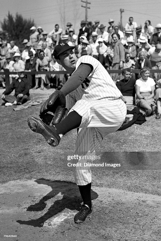 Vic Raschi Pitcher Vic Raschi of the New York Yankees warms up in the bullpen ...