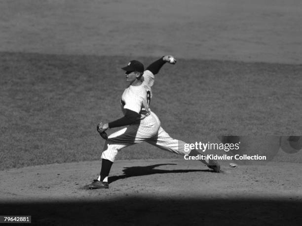 Pitcher Don Larsen of the New York Yankees throws a pitch during game 5 of the World Series on October 8, 1956 against the Brooklyn Dodgers at Yankee...