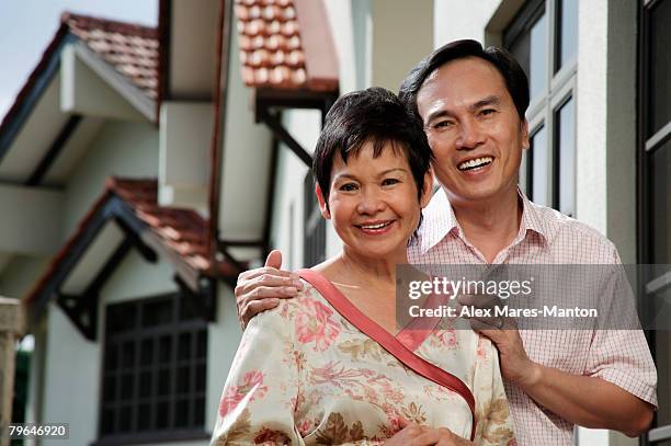 mature couple smiling at camera - stereotypically upper class stock pictures, royalty-free photos & images