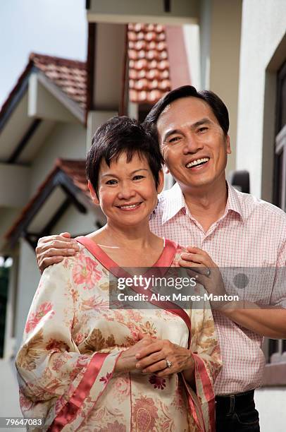 mature couple smiling at camera - stereotypically upper class stock pictures, royalty-free photos & images