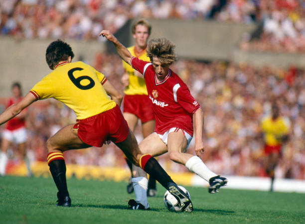August 1984, Division 1, Manchester United 1 v Watford 1, Manchester United's Danish international Jesper Olsen takes on Watford's Lee Sinnott