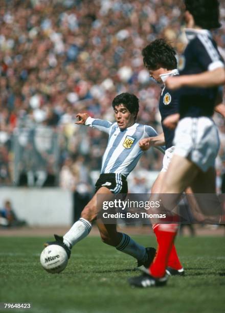 2nd June 1979, Friendly International, Scotland 1 v Argentina 3, Argentina's Diego Maradona plays the ball past the Scottish defenders, Diego...