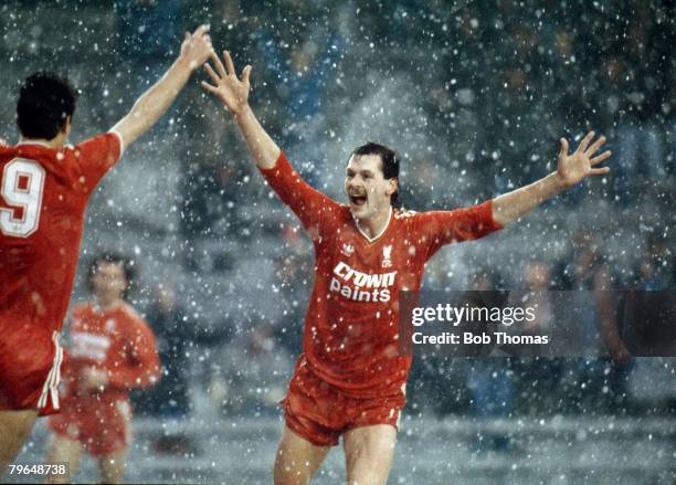 Kevin MacDonald of Liverpool celebrates with Ian Rush after scoring the first goal in Liverpool's FA Cup third round game with Norwich City at...