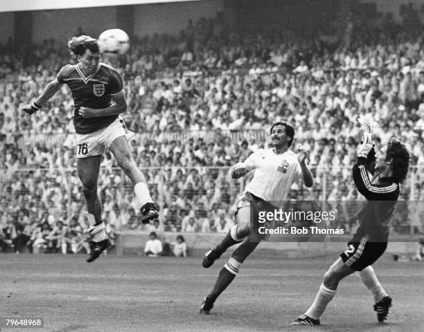 16th June 1982, 1982 World Cup Finals, Bilbao, Spain, Group Four, England 3 v France 1, England's Bryan Robson leaps high to head past France...