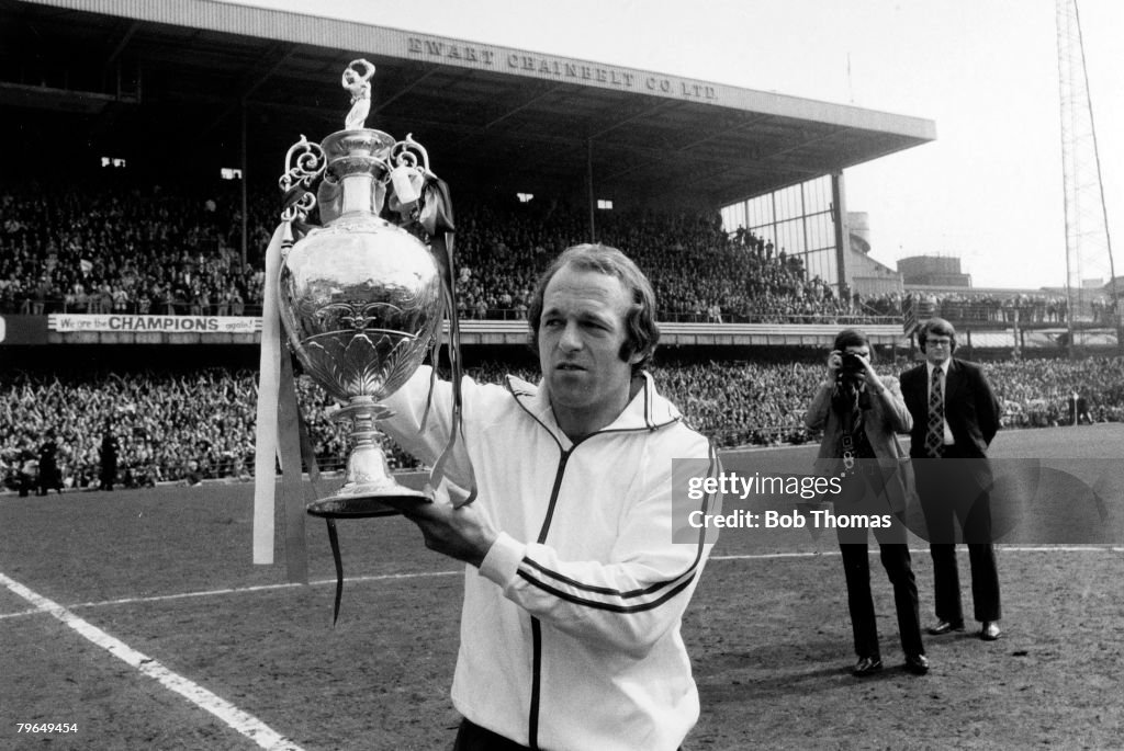 BT Sport, Football, pic: 26th April 1975, Division 1, Derby County v Carlisle United, Derby County captain Archie Gemmill holds aloft the League Championship trophy at the Baseball Ground, as Derby win the title