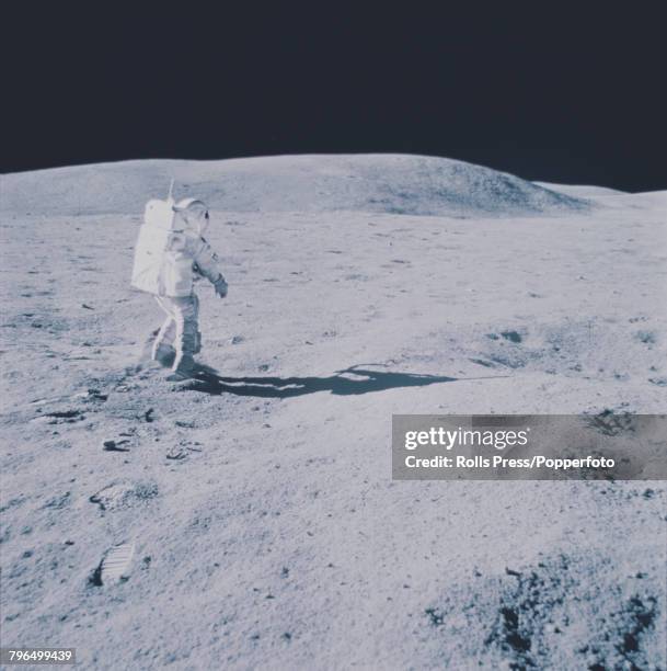 Apollo 16 Lunar Module pilot Charles Duke is pictured wearing his space suit on the lunar surface of the Moon as Commander John Young takes the...