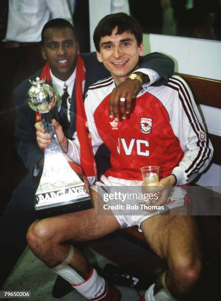 Arsenal striker Alan Smith celebrates with David Rocastle, behind, after winning the League Championship for season 1990-1991