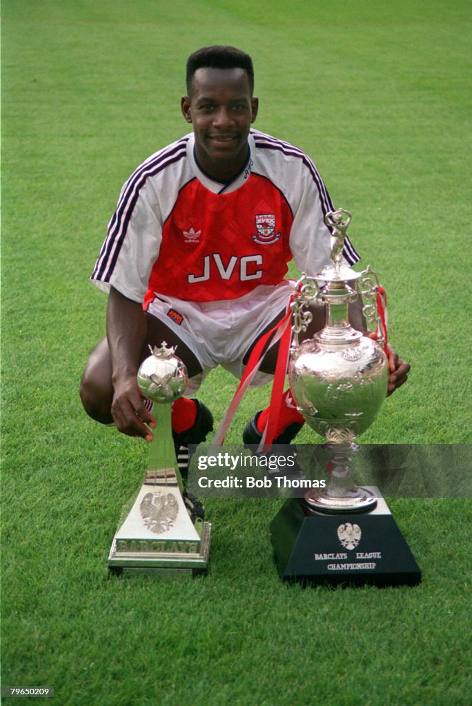 BT Sport, Football, pic: 1991, Arsenal's Michael Thomas with the First Division Championship trophies won by the club in season 1990-1991