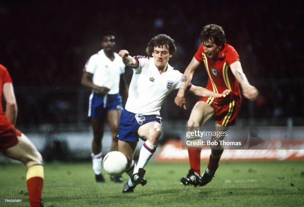 Sport, Football, pic: 23rd May 1979, British Championship, Wembley, England,0,v Wales,0, England's Steve Coppell, left, under pressure from Wales defender Joey Jones, Steve Coppell was a regular in the Manchester United side 1975-1983 and was a nippy righ
