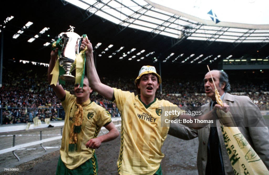 Sport, Football, Milk Cup Final, Wembley, 24th March 1985, Norwich City 1 v Sunderland 0, Norwich City's John Deehan (left) and Steve Bruce celebrate with the trophy