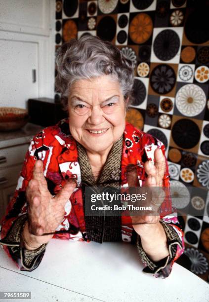 England, Circa 1970, Actress Violet Carson who plays the role of Ena Sharples in the television series "Coronation Street" is pictured with her...