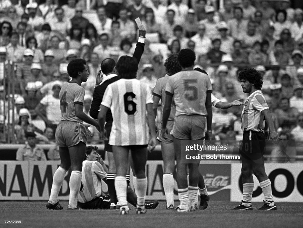 Football, 1982 World Cup Finals, Second Phase, Group C, Barcelona, Spain, 2nd July 1982, Brazil 3 v Argentina 1, Players surround the referee as Argentina's Diego Maradona is shown the red card for a vicious foul on Brazil's Batista