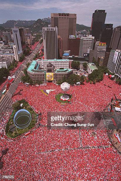 Tens of thousands of South Korean soccer fans gathered in central Seoul to watch a telecast of the World Cup quarter-final match between South Korea...