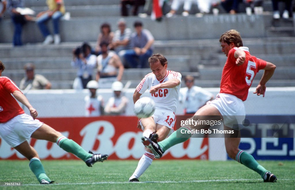 1986 World Cup Finals, Irapuato, Mexico, 2nd June, 1986, USSR 6 v Hungary 0, USSR's Igor Belanov clears the ball as Hungary's Josef Kardos tries to block