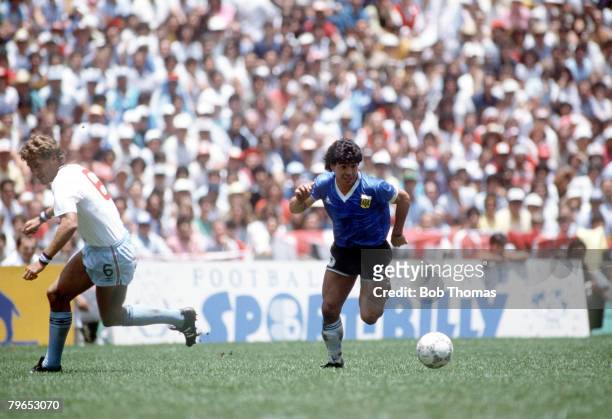 World Cup Quarter Final, Azteca Stadium, Mexico, 22nd June Argentina 2 v England 1, Argentina's Diego Maradona moves past English defender Terry...