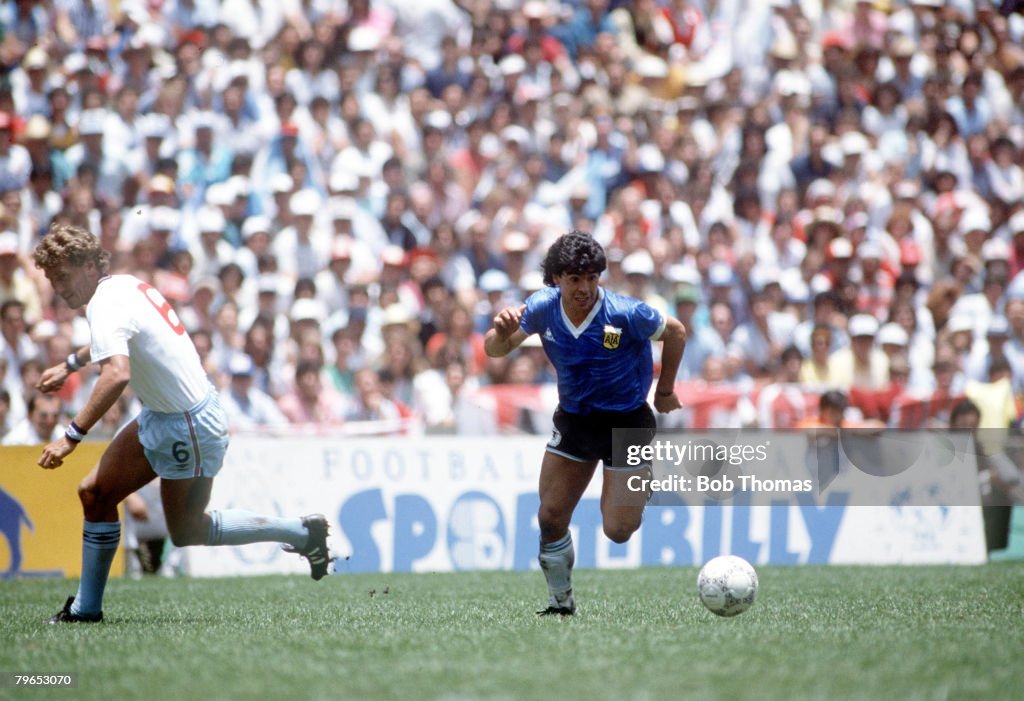 1986 World Cup Quarter Final, Azteca Stadium, Mexico, 22nd June, 1986, Argentina 2 v England 1, Argentina's Diego Maradona moves past English defender Terry Butcher on his way to scoring his outstanding individual second goal