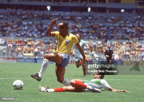 World Cup Finals, Guadalajara, Mexico, 6th June Brazil 1 v Algeria 0, Brazil's Elzo beats Algeria's Lakhdar Belloumi