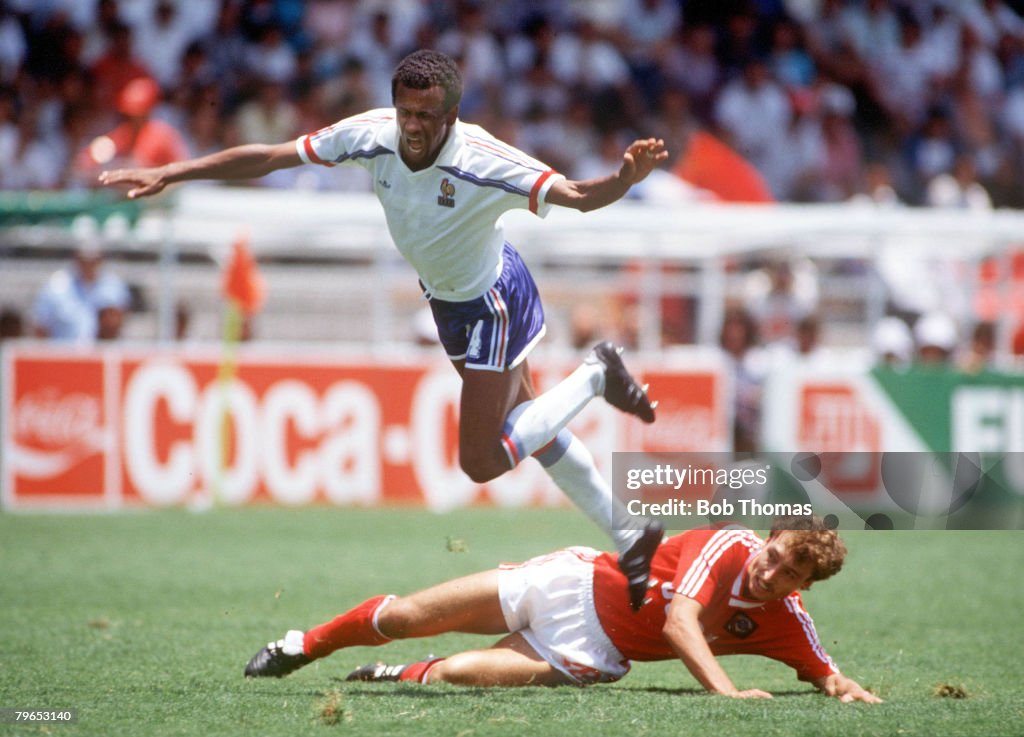 1986 World Cup Finals, Leon, Mexico, 5th June, 1986, France 1 v USSR 1, France's Jean Tigana hurdles USSR's Sergei Aleinikov