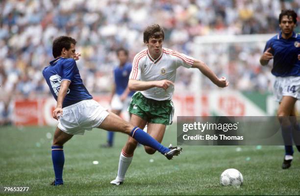 World Cup Finals, Azteca Stadium, Mexico, 31st May 1986, Italy 1 v Bulgaria 1, Italy's Gaetano Scirea tries to tackle Bulgaria's Nasko Sirakov