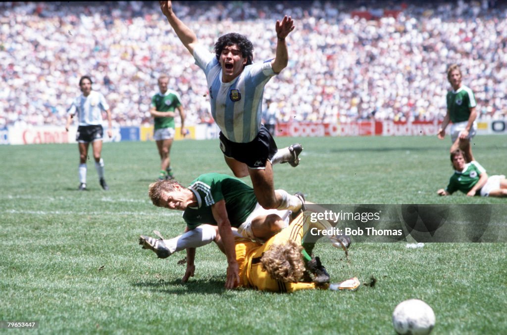 1986 World Cup Final, Azteca Stadium, Mexico, 29th June, 1986, Argentina 3 v West Germany 2, Argentina's Diego Maradona goes flying over the challenges of West German goalkeeper Harald Schumacher and defender Karl Heinz Foerster