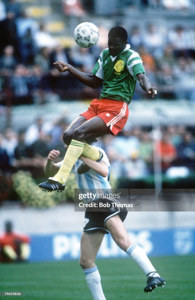 1990 World Cup Finals, Milan, Italy, 8th June, 1990, Argentina 0 v Cameroon 1, Cameroon's Oman Biyick leaps high to head the ball for the only goal of the game