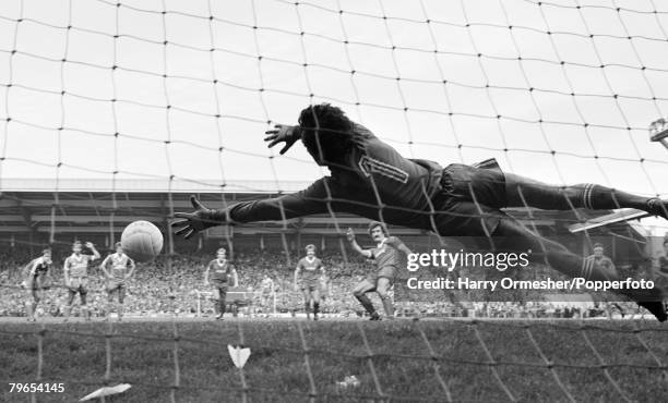 Terry McDermott of Liverpool scores a penalty past Brighton & Hove Albion goalkeeper Graham Moseley during a Football League Division One match at...