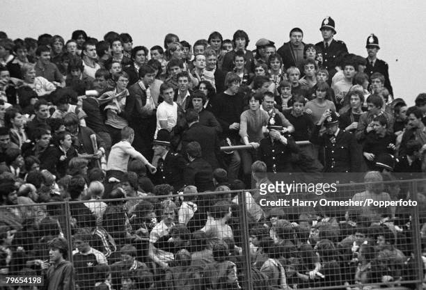 Police move in to separate two sets of rival supporters as trouble flares during the Football League Division One match between Leeds United and...
