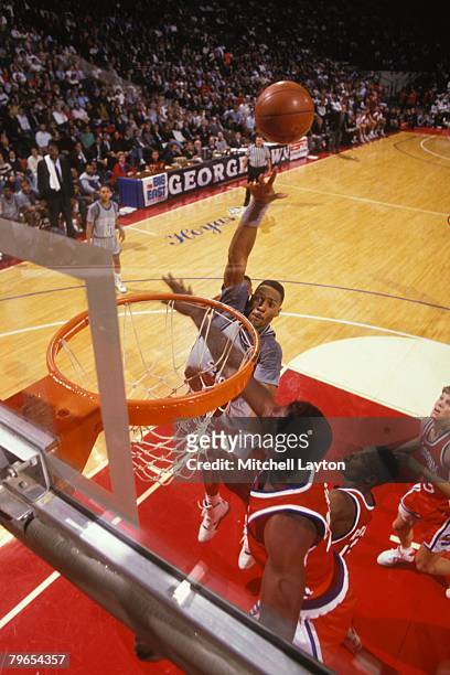 Alonzo Mourning of the Georgetown Hoyas takes a shot during a basketball game against the Syracuse Orange at Capital Centre on February 1, 1992 in...