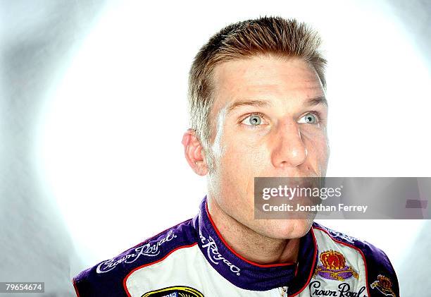 Jamie McMurray, driver of the Crown Royal Ford, poses for a photo during the NASCAR Sprint Cup Series media day at Daytona International Speedway on...