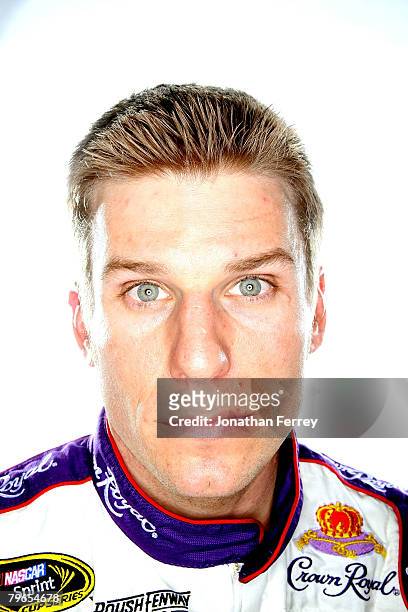 Jamie McMurray, driver of the Crown Royal Ford, poses for a photo during the NASCAR Sprint Cup Series media day at Daytona International Speedway on...