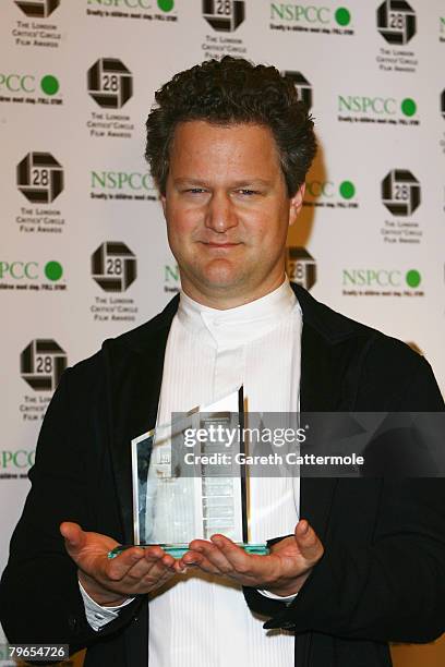 Florian Henckel von Donnersmarck poses with the Screenwriter of the Year award for "The Lives of Others" while attending the Awards Of The London...