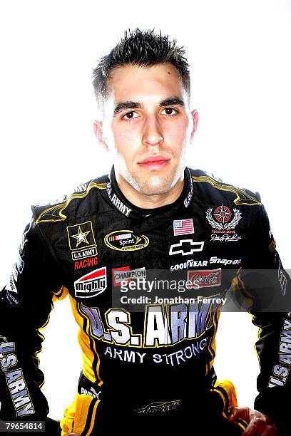 Aric Almirola, driver of the U.S. Army Chevrolet, poses for a photo during the NASCAR Sprint Cup Series media day at Daytona International Speedway...