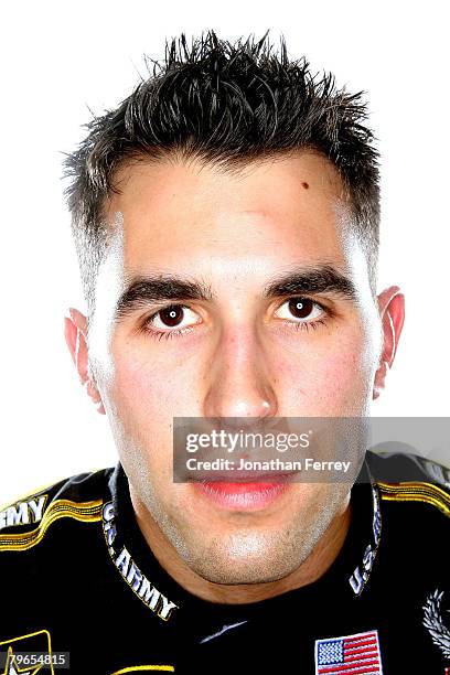 Aric Almirola, driver of the U.S. Army Chevrolet, poses for a photo during the NASCAR Sprint Cup Series media day at Daytona International Speedway...